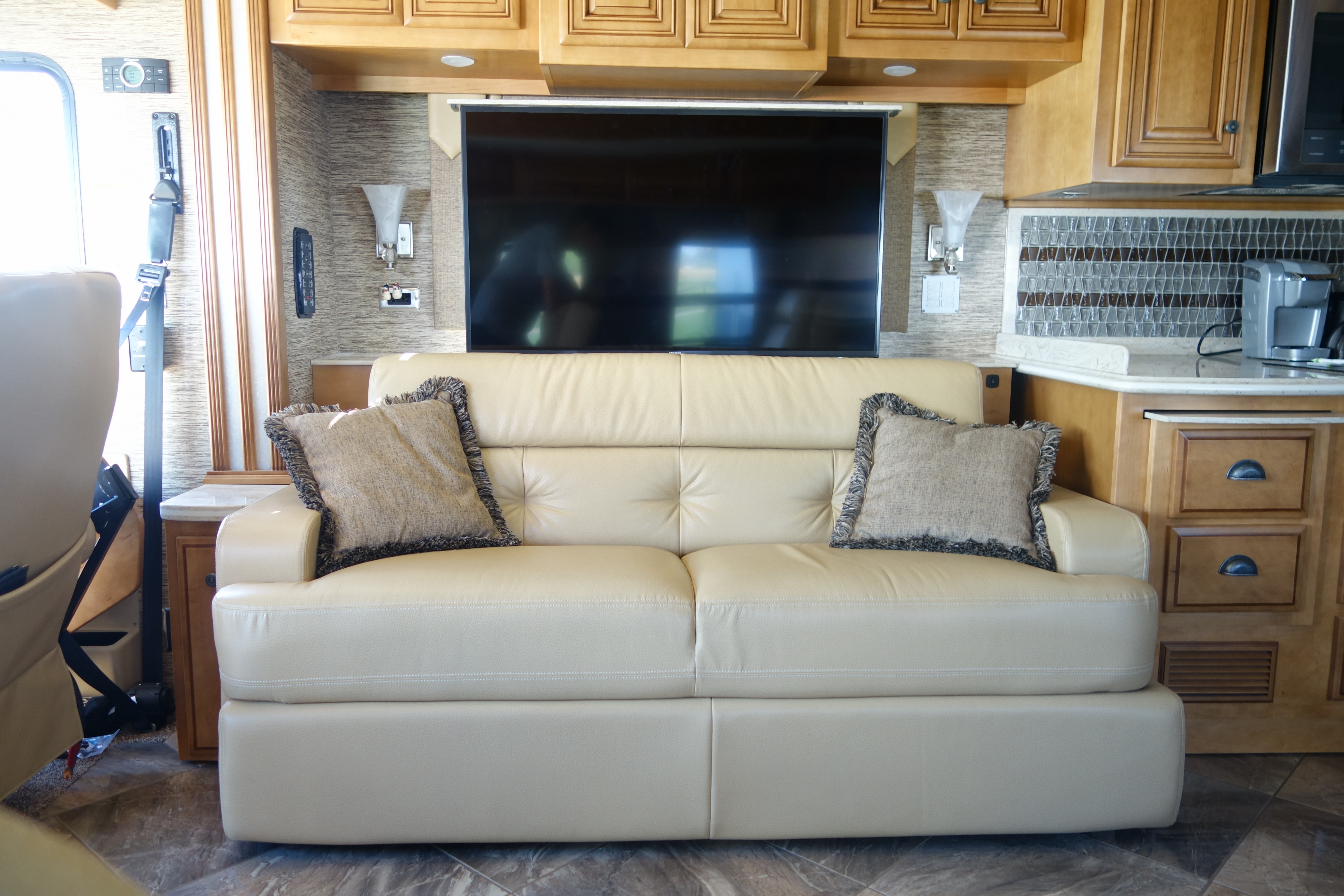 The televator TV cabinet with left side storage placed above couch